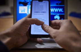 ep archivo   una persona con el movil y el ordenador encendidos en madrid espana a 9 de febrero de