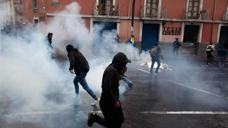ep 03 october 2019 ecuador quito demonstrators run away from tear gas during a protest against the