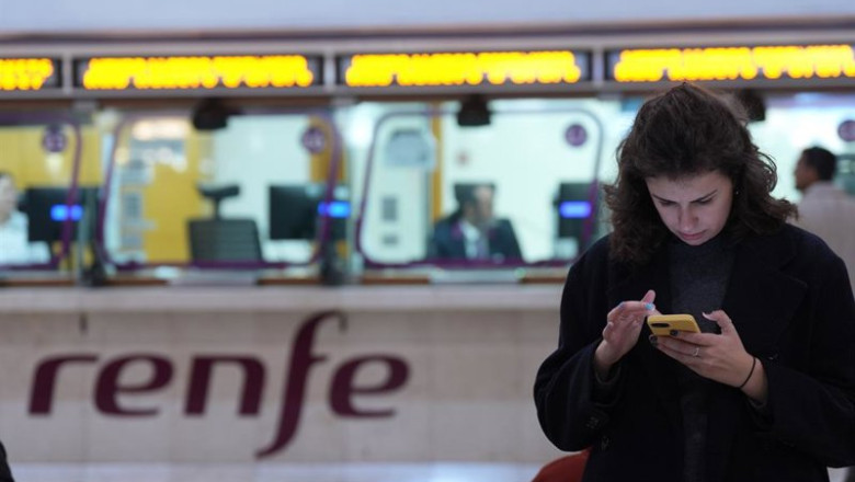 ep archivo   una persona espera en la estacion de sants ante una ventanilla de renfe