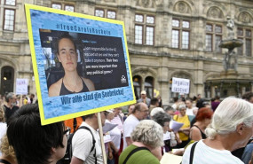 ep 02 july 2019 austria vienna people hold placards duringdemonstration to call on the italian authorities to release sea watch captain carola rackete photo hans punzapadpa