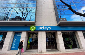 ep archivo   una persona pasa por delante de una oficina de la compania aseguradora pelayo en madrid