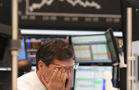 ep main a stock trader rubs his eyes on the floor of the frankfurt stock exchange stock exchanges