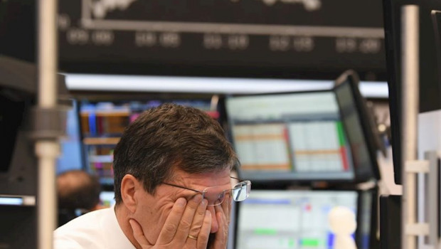 ep main a stock trader rubs his eyes on the floor of the frankfurt stock exchange stock exchanges