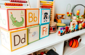 set of kid toys on white shelf 