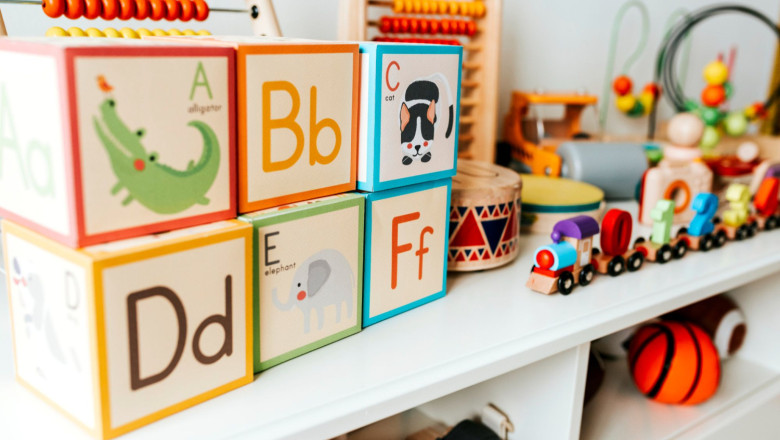 set of kid toys on white shelf 