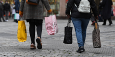 women with shopping bags walk through the city center in nuremberg 